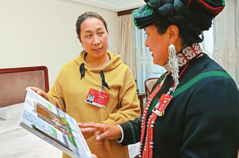 人民大會(huì)堂里分享大涼山脫貧奔康的甜蜜